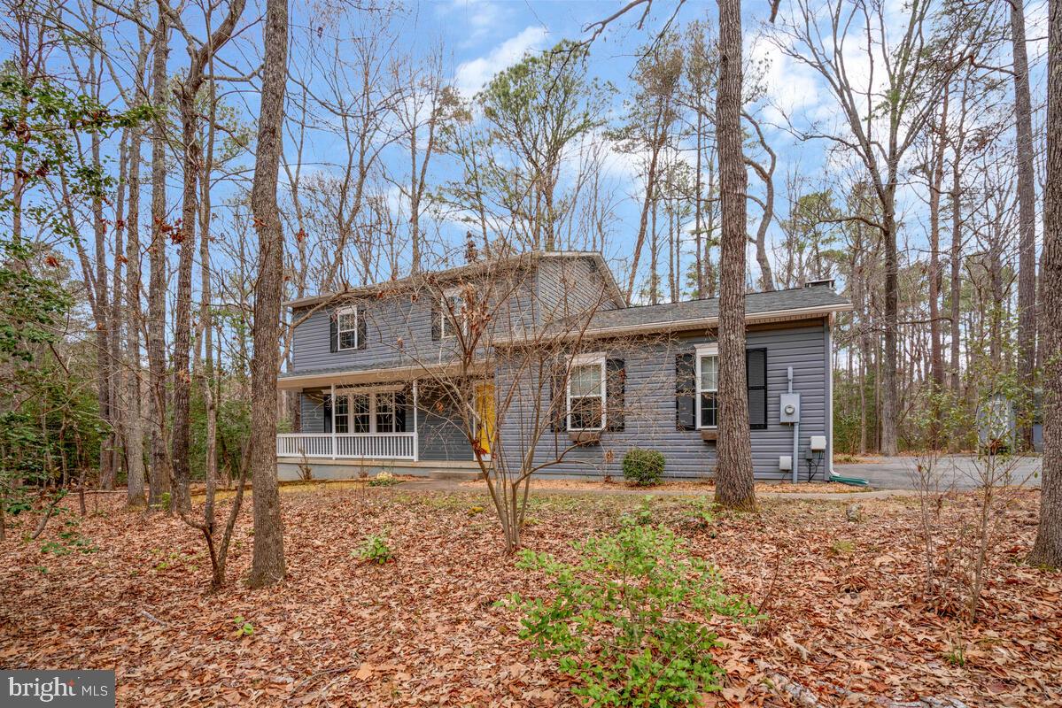 44576 Cedar Court California, MD 20619 - Photo 3 of 45 a front view of a house with a yard