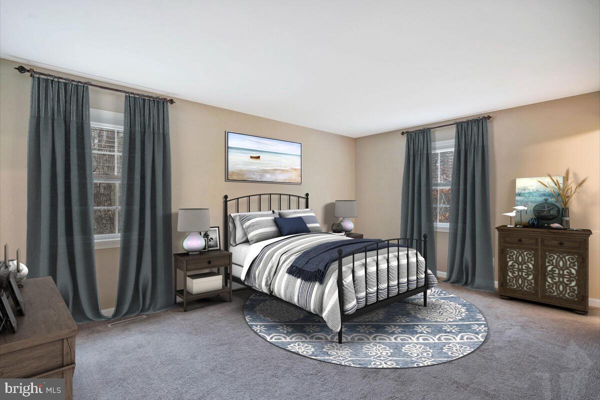 44576 Cedar Court California, MD 20619 - Photo 33 of 45 a bedroom with a bed and large windows