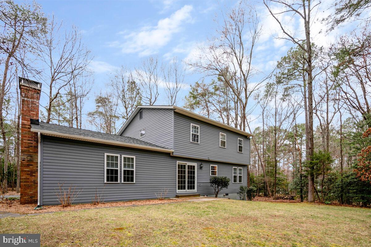 44576 Cedar Court California, MD 20619 - Photo 39 of 45 a front view of a house with a yard