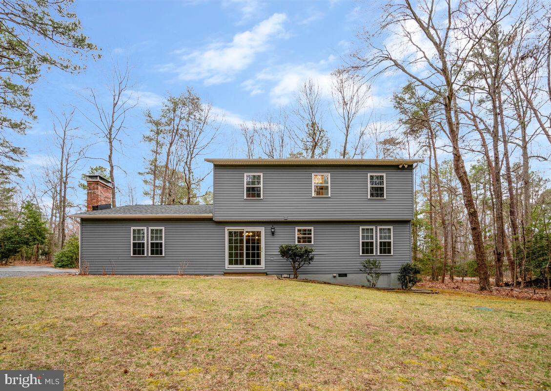 44576 Cedar Court California, MD 20619 - Photo 40 of 45 a view of a house with a yard and garage