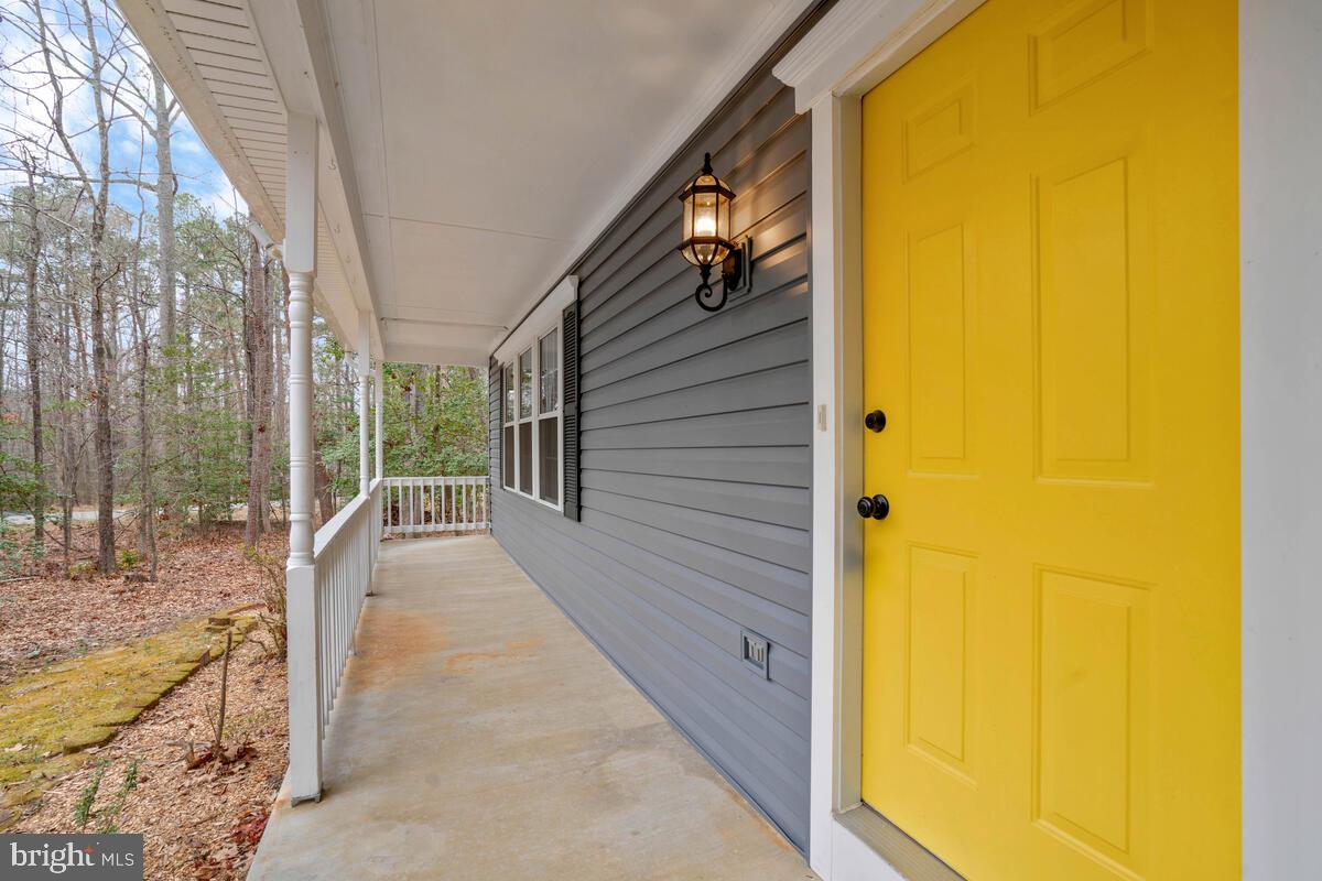 44576 Cedar Court California, MD 20619 - Photo 4 of 45 a view of porch with a door and wooden floor