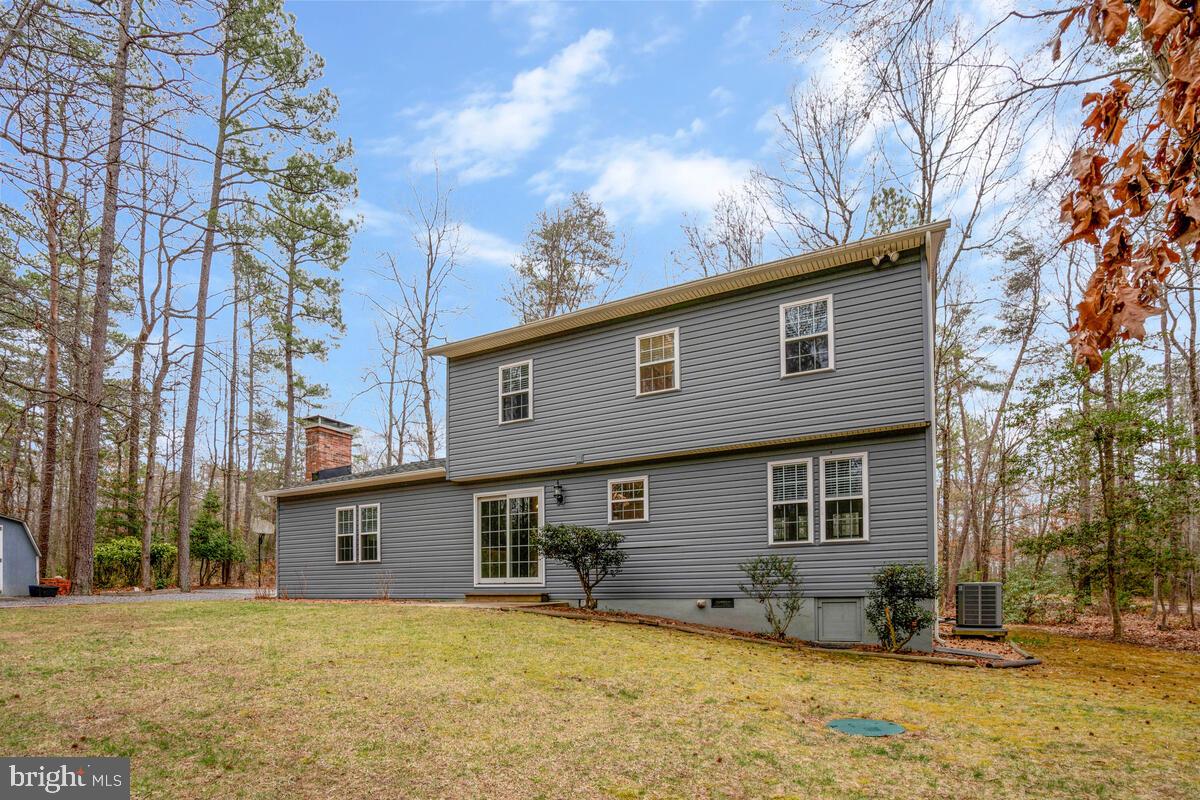44576 Cedar Court California, MD 20619 - Photo 41 of 45 a house that has a tree in front of it