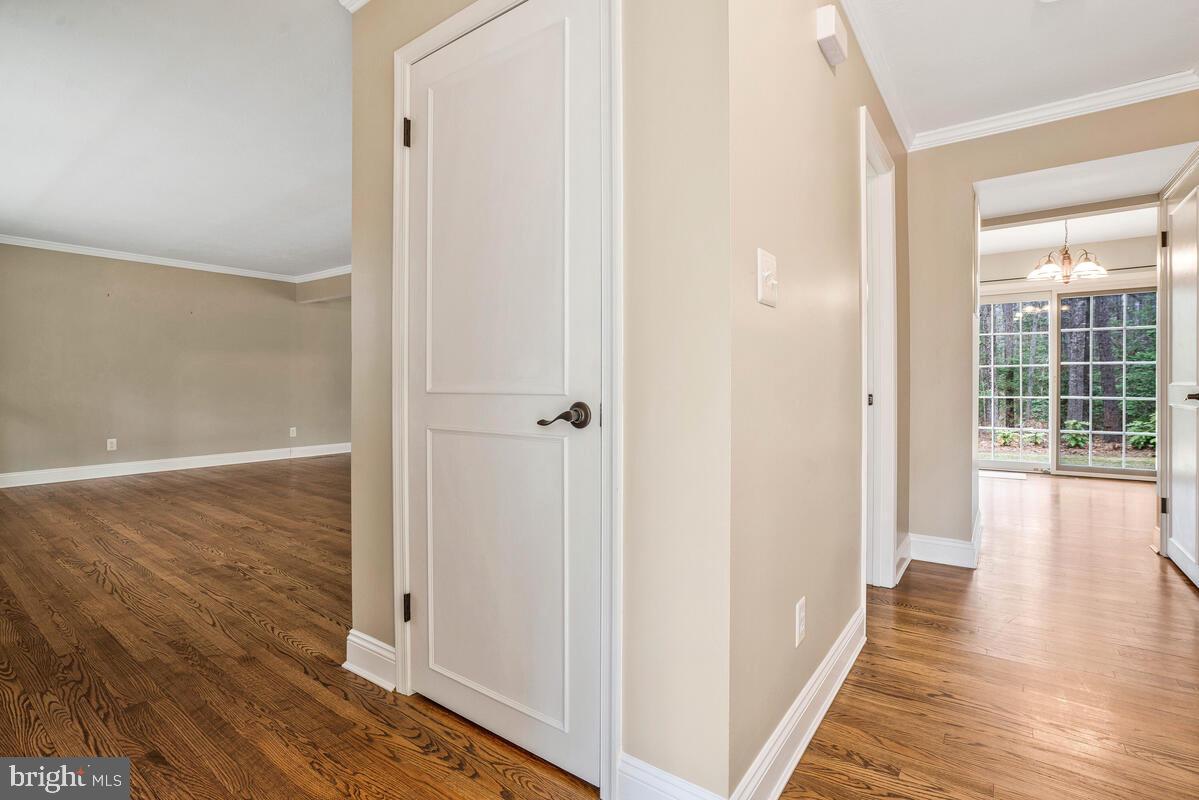 44576 Cedar Court California, MD 20619 - Photo 9 of 45 a view of a hallway with wooden floor