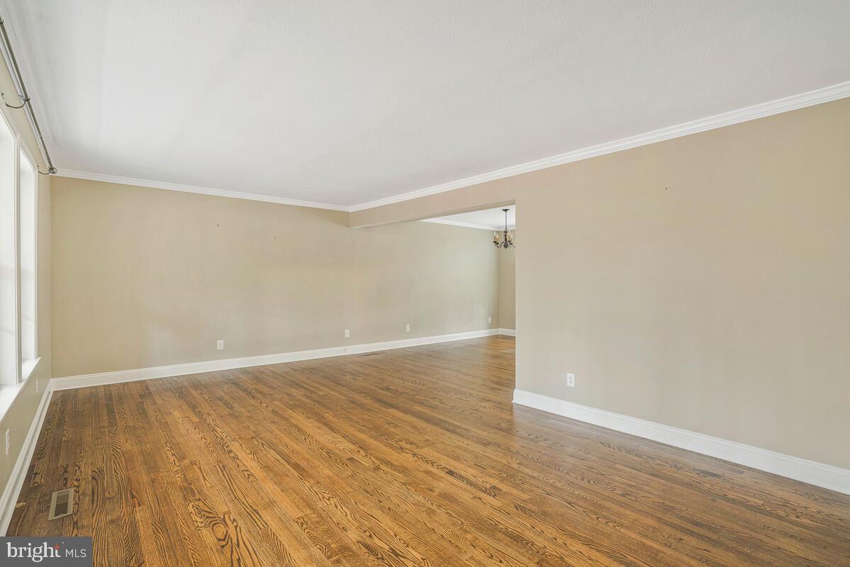 44576 Cedar Court California, MD 20619 - Photo 10 of 45 a view of an empty room with wooden floor and a window