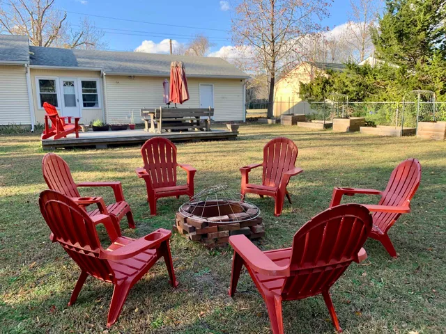 a backyard of a house with outdoor seating