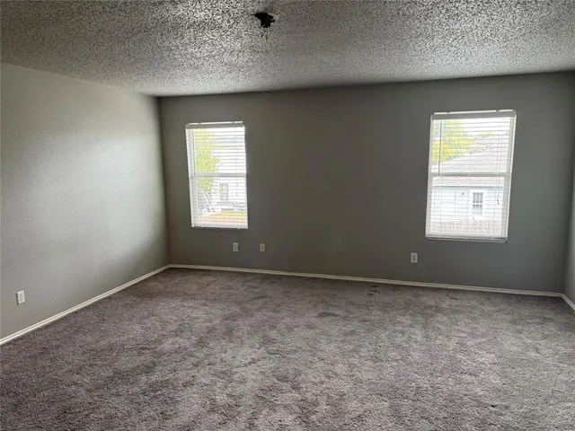 an empty room that has a window in it