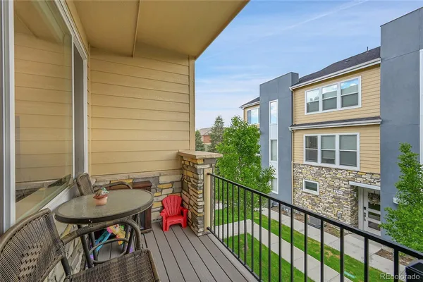 a view of a house with a yard and balcony