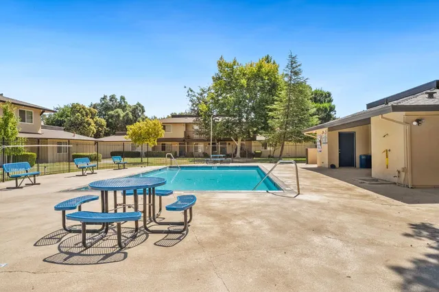 a view of swimming pool with sitting area and seating area