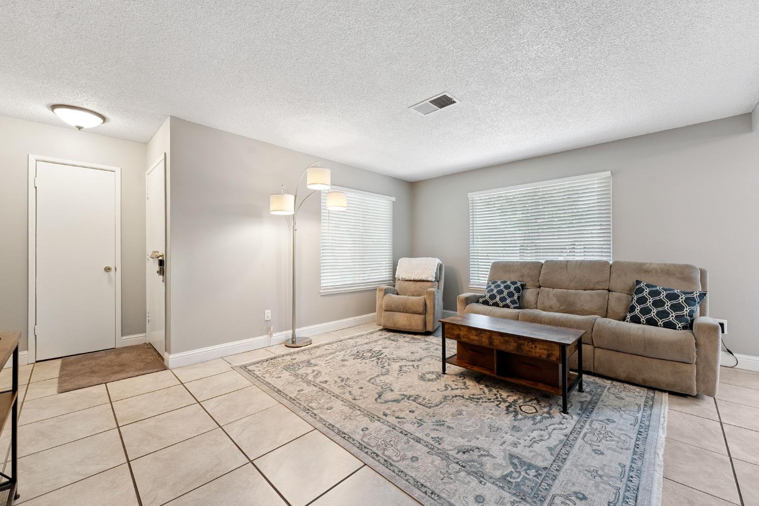 56 West Elliot Street, Unit 61 Woodland, CA 95695 - Photo 4 of 17 a living room with furniture and a window