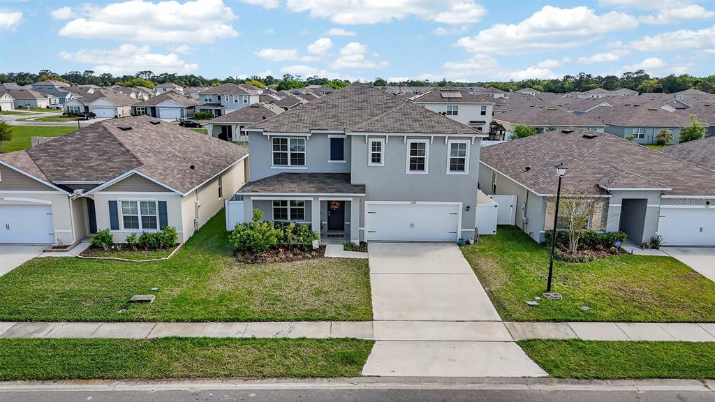 1809 Myrtlebrooke Drive Edgewater, FL 32141 - Photo 44 of 58 a aerial view of a brick house many windows