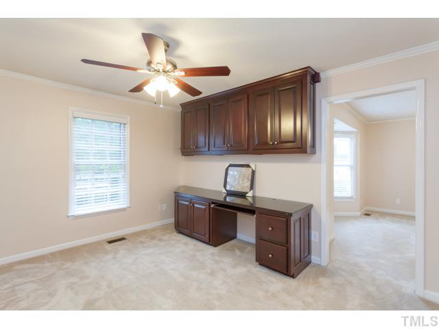 7312 Wilderness Road Raleigh, NC 27613 - Photo 12 of 23 a kitchen with stainless steel appliances granite countertop a sink a stove and a window