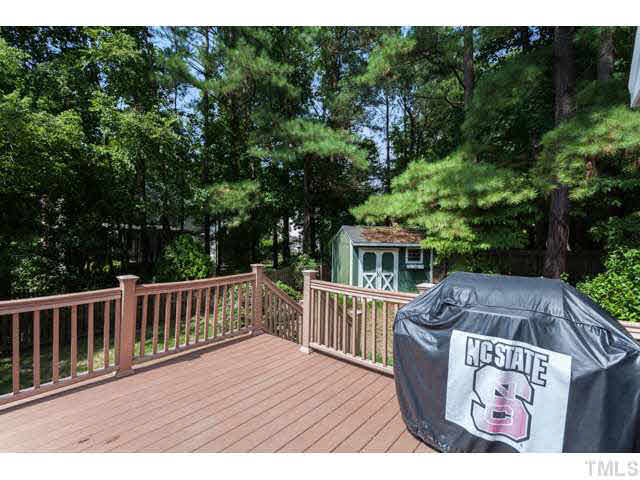 7312 Wilderness Road Raleigh, NC 27613 - Photo 20 of 23 a view of backyard with deck and outdoor seating