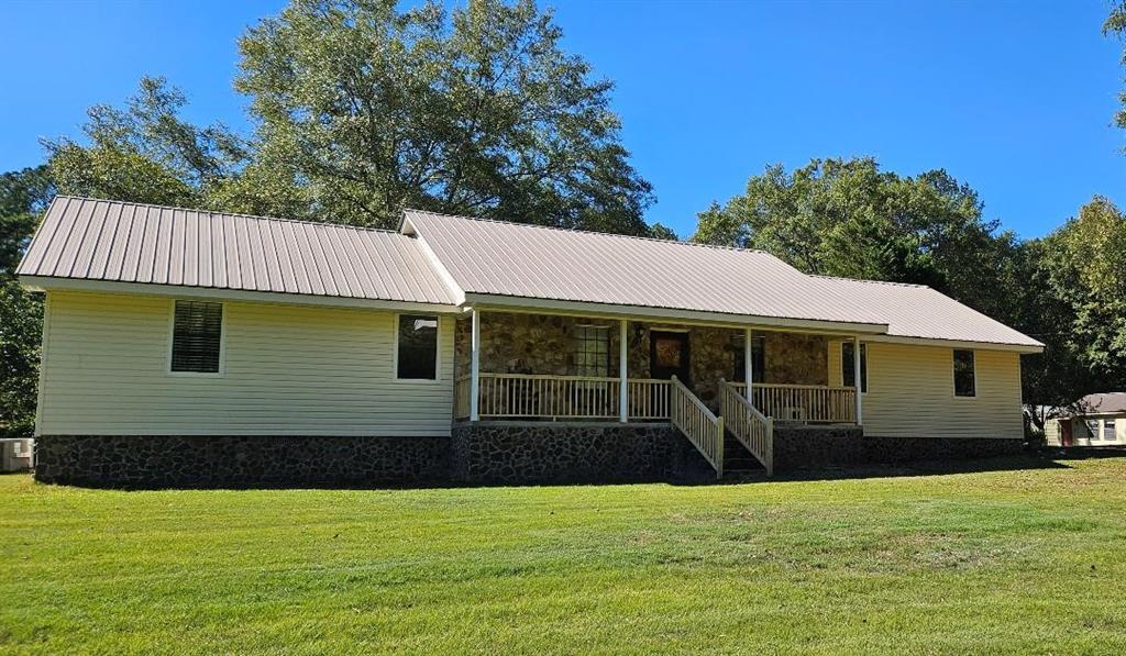 694 Looney Road Southwest Rome, GA 30165 - Photo 1 of 1 a view of a house with backyard and garden