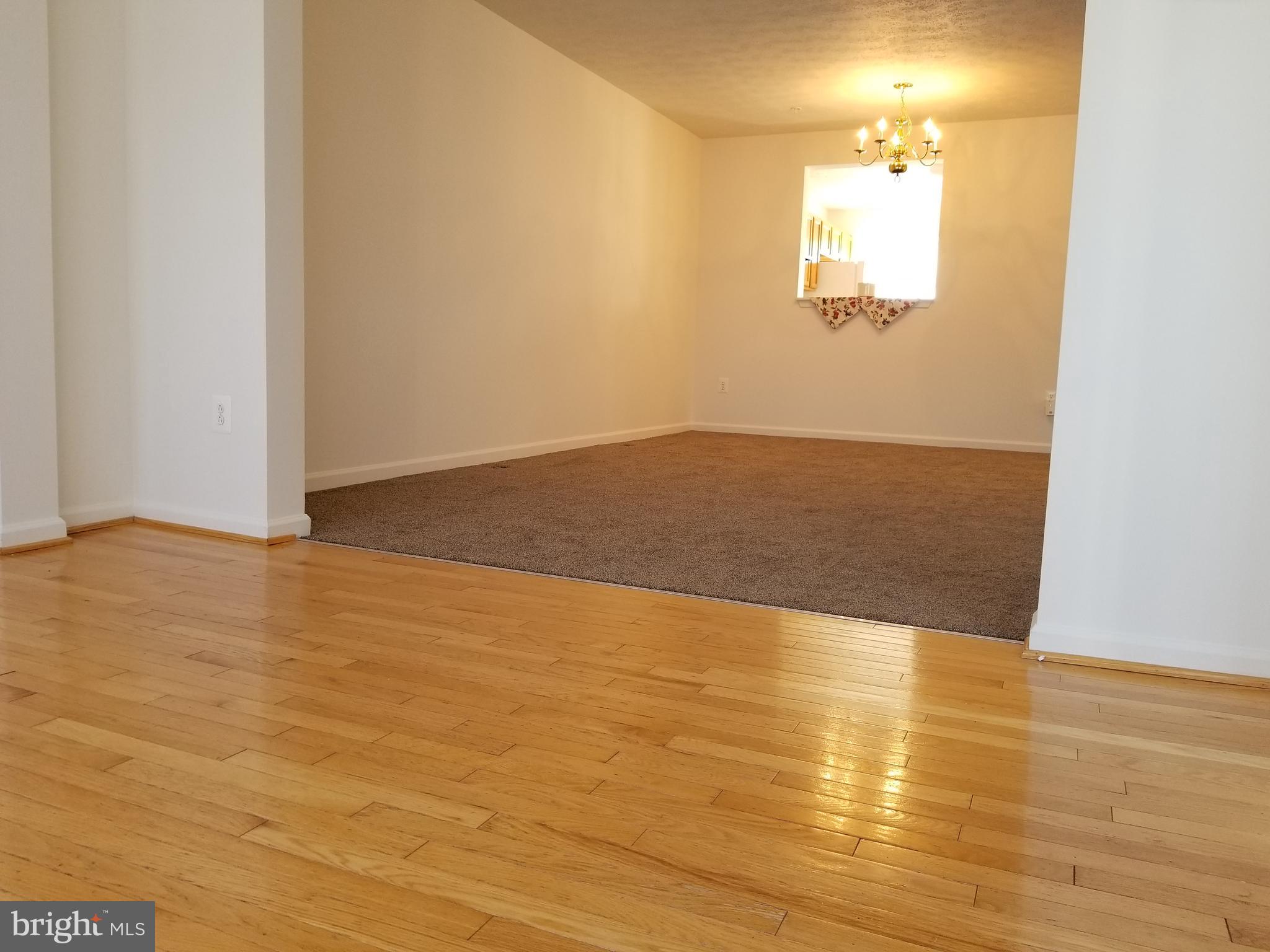 9736 Selfridge Road Baltimore, MD 21220 - Photo 14 of 35 a view of empty room with wooden floor