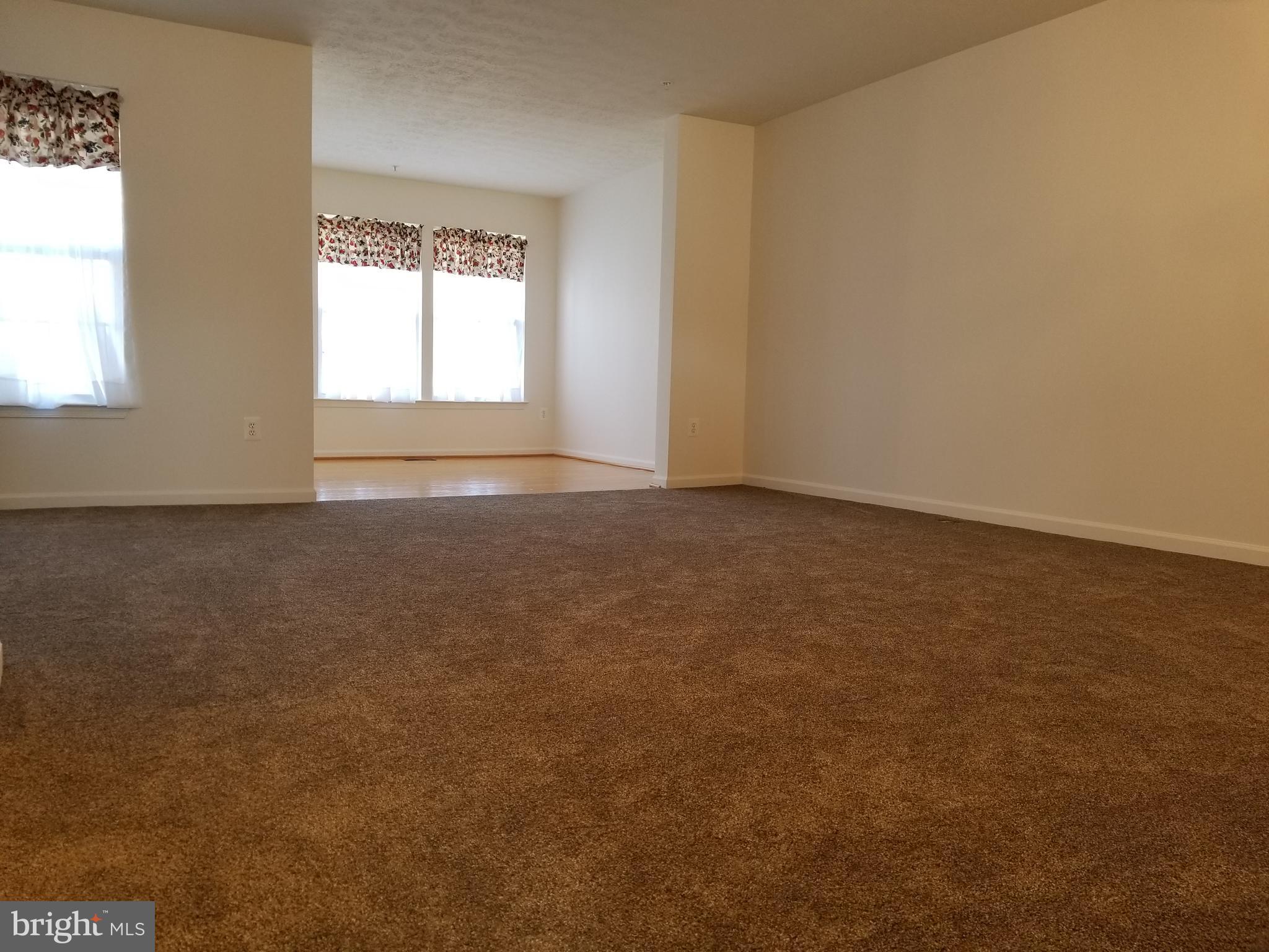 9736 Selfridge Road Baltimore, MD 21220 - Photo 15 of 35 an empty room with windows