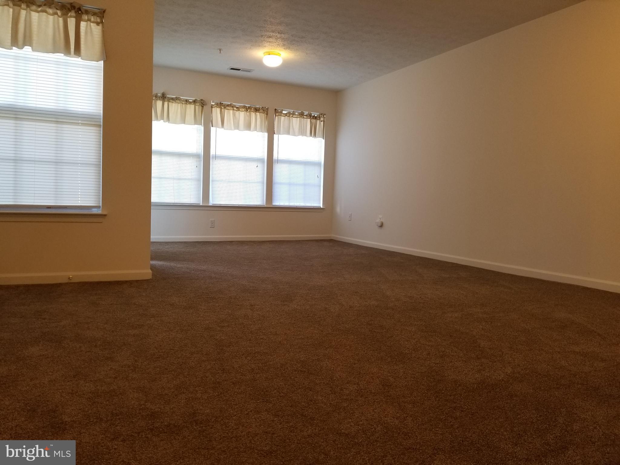 9736 Selfridge Road Baltimore, MD 21220 - Photo 18 of 35 an empty room with a window
