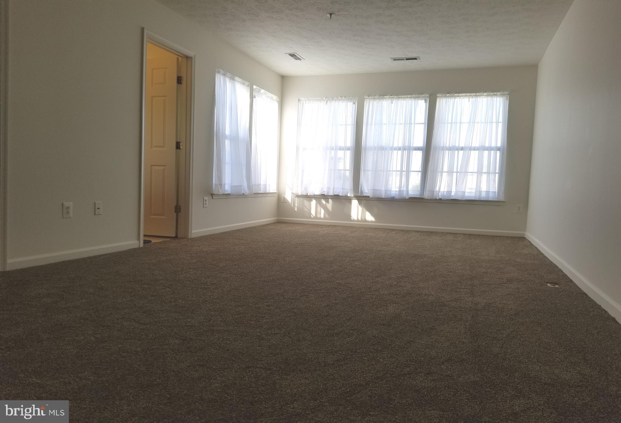 9736 Selfridge Road Baltimore, MD 21220 - Photo 20 of 35 an empty room with windows