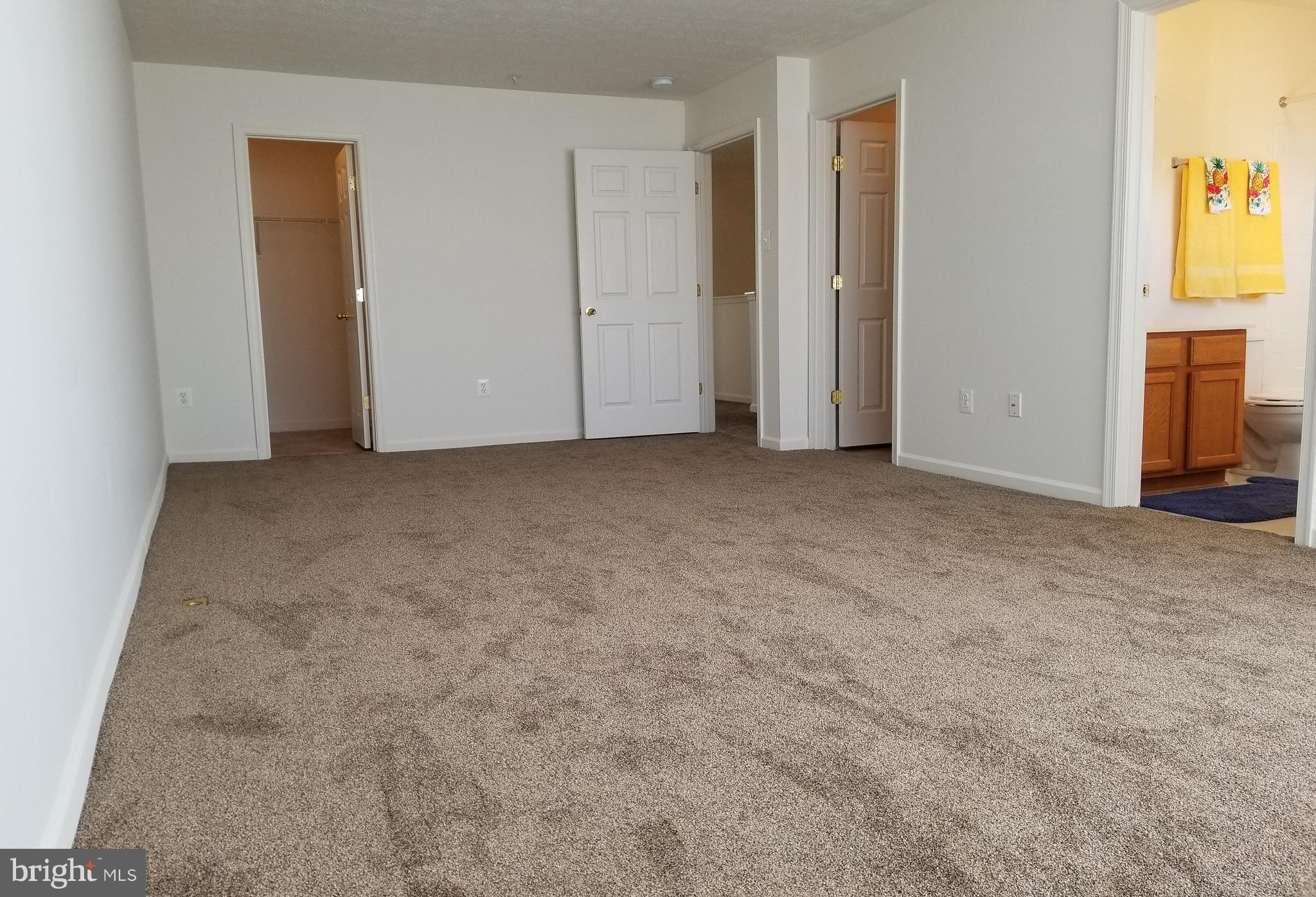 9736 Selfridge Road Baltimore, MD 21220 - Photo 21 of 35 an empty room with windows and closet