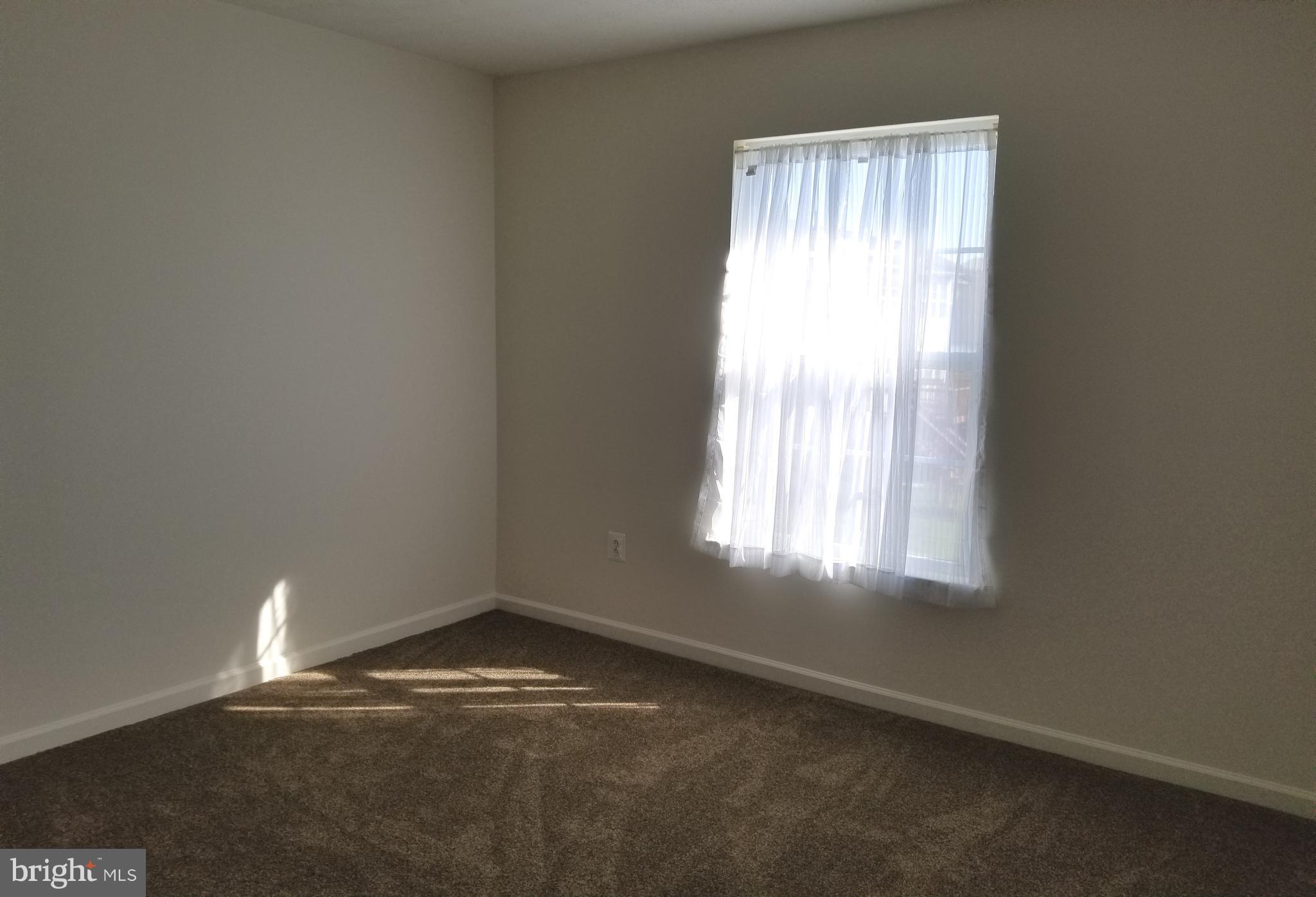 9736 Selfridge Road Baltimore, MD 21220 - Photo 26 of 35 an empty room with a window