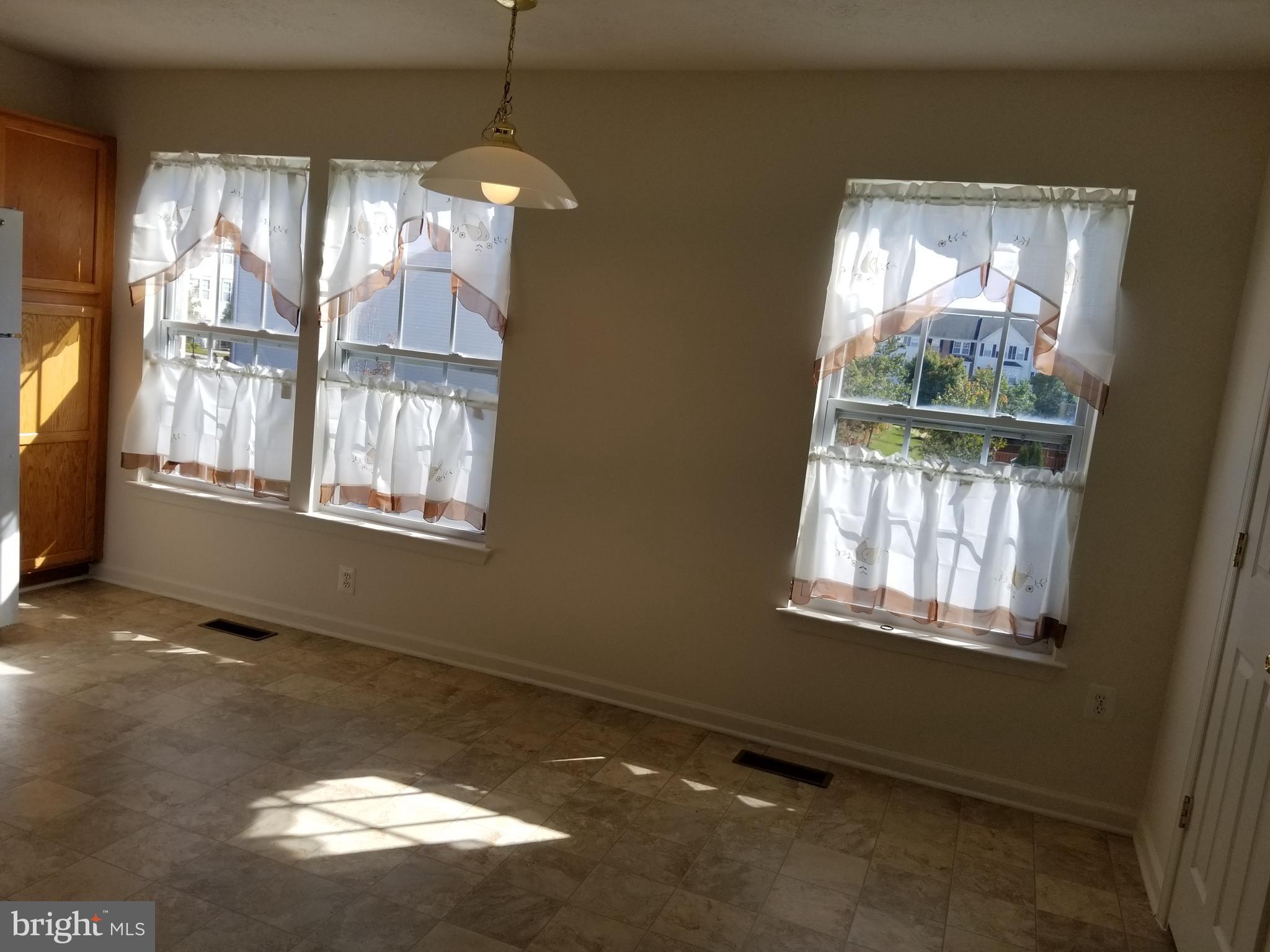 9736 Selfridge Road Baltimore, MD 21220 - Photo 6 of 35 a view of an empty room with a window