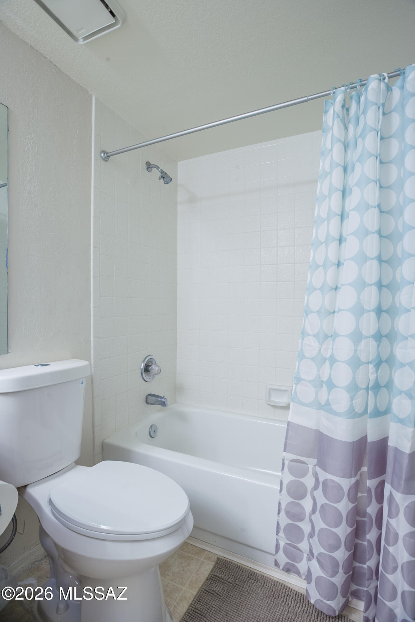 1200 East River Road, Unit B27 Tucson, AZ 85718 - Photo 28 of 40 a white toilet sitting next to a bath tub and a shower