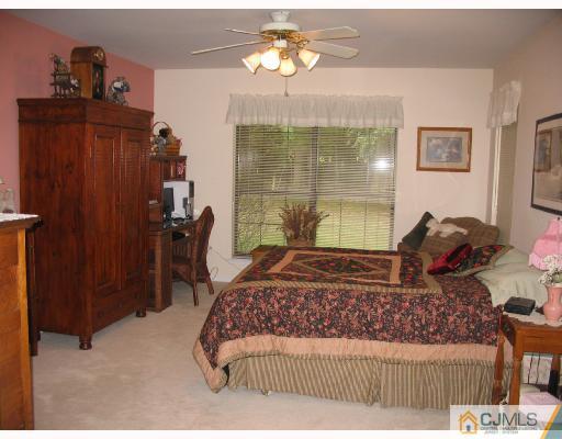 0 Timber Oaks Road Edison, NJ 08820 - Photo 6 of 10 a living room with a bed furniture and a window