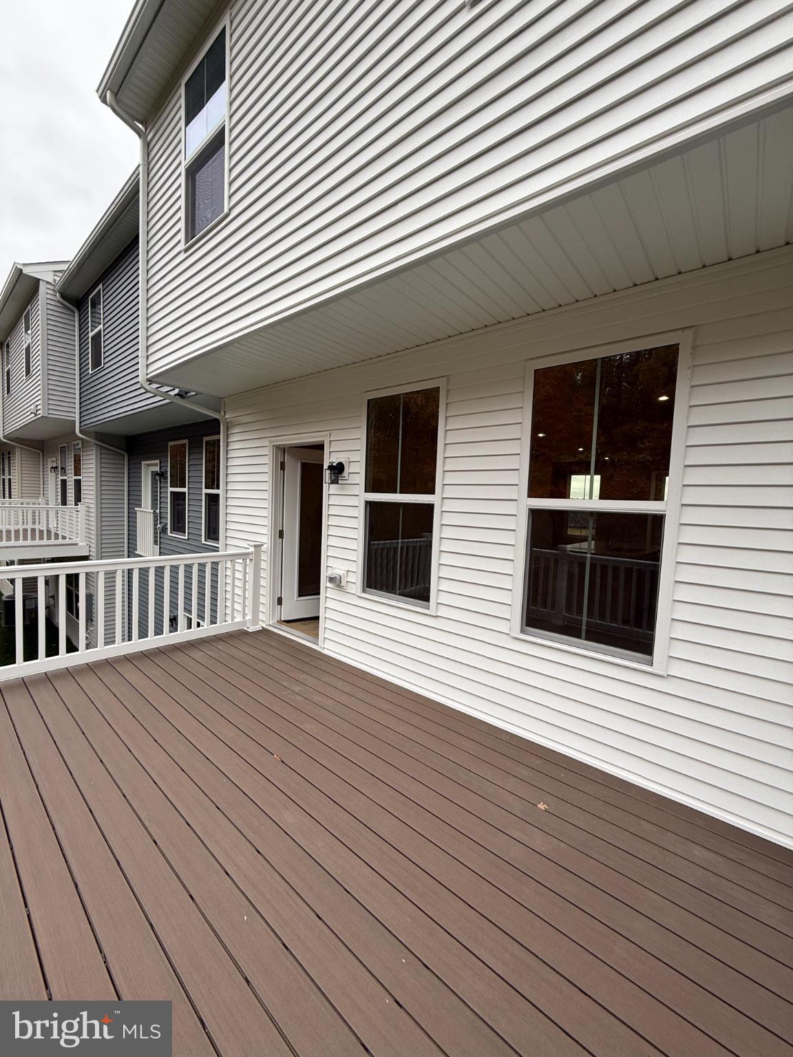 6932 Braxton Springs Way Spotsylvania, VA 22553 - Photo 13 of 33 a view of a house with wooden deck