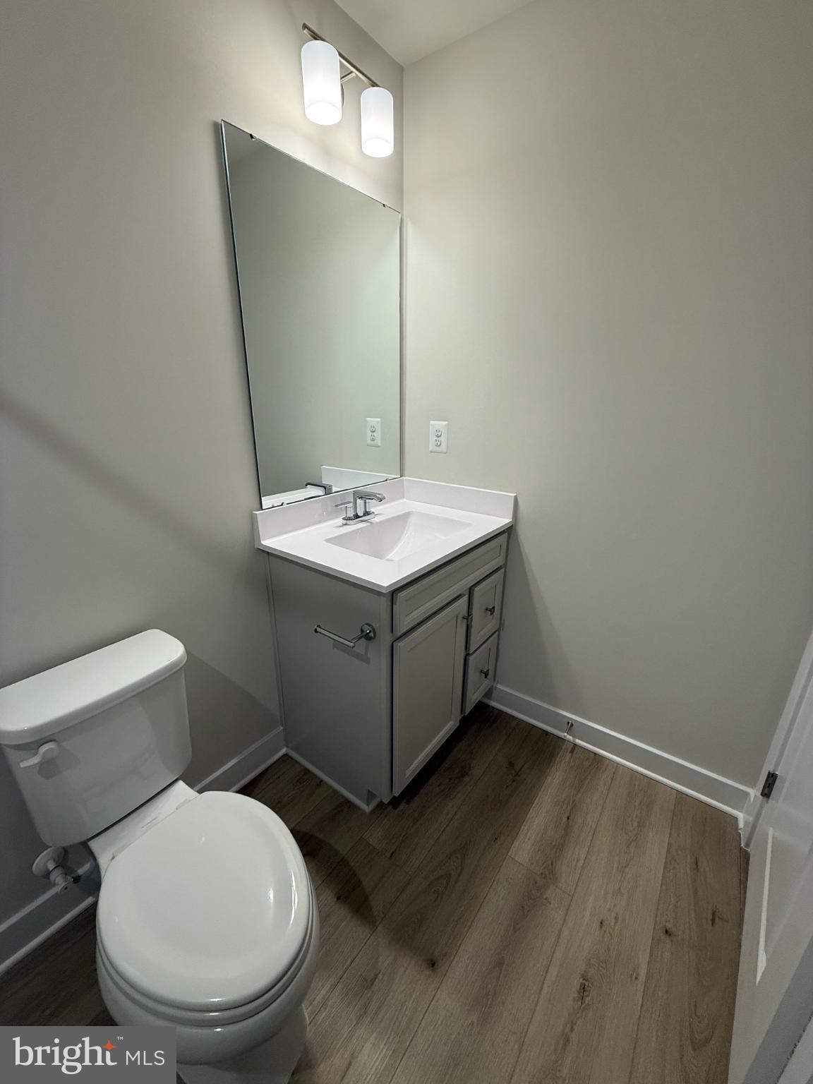 6932 Braxton Springs Way Spotsylvania, VA 22553 - Photo 22 of 33 a bathroom with a toilet sink and mirror