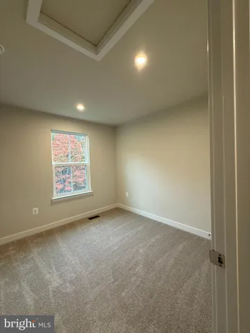 a view of kitchen with cabinets and wooden floor