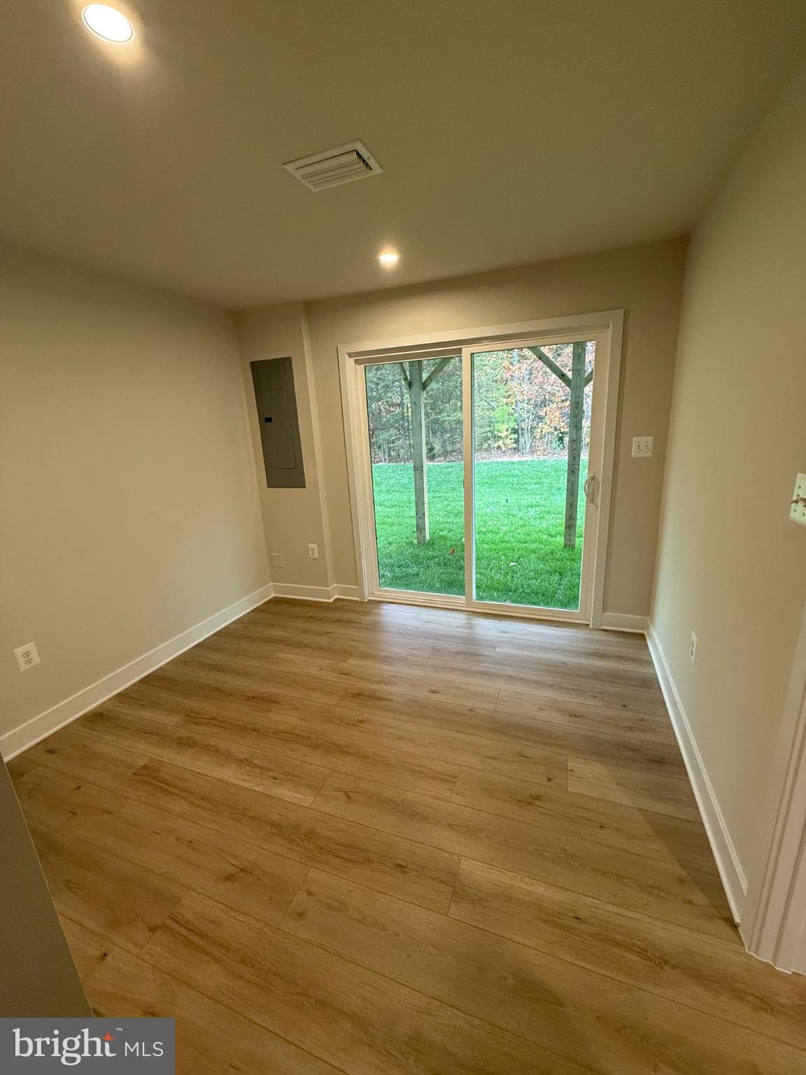 6932 Braxton Springs Way Spotsylvania, VA 22553 - Photo 3 of 33 a view of empty room with wooden floor and fan