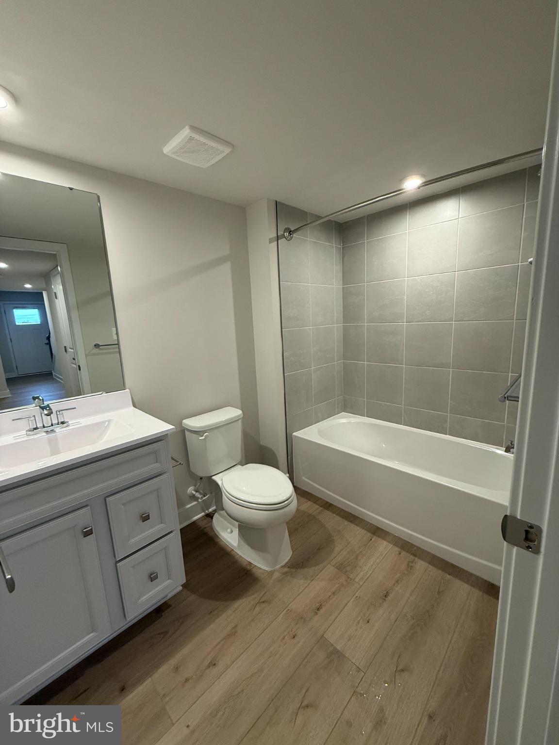 6932 Braxton Springs Way Spotsylvania, VA 22553 - Photo 4 of 33 a bathroom with a bathtub shower sink mirror and toilet