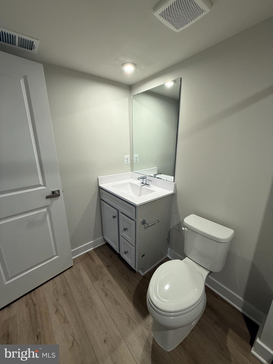 6932 Braxton Springs Way Spotsylvania, VA 22553 - Photo 5 of 33 a bathroom with a toilet sink and mirror