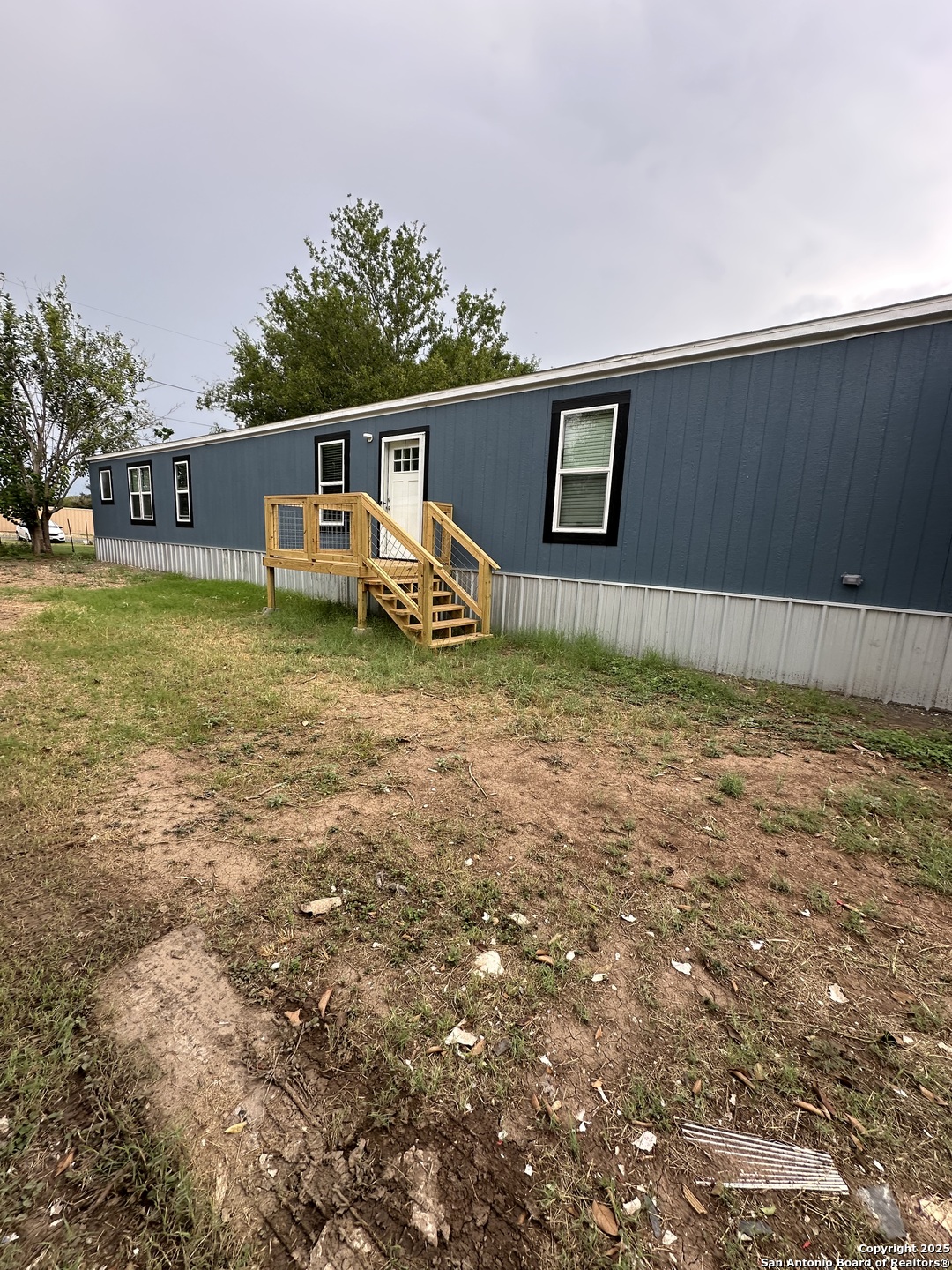 19 Green Meadows Knippa, TX 78870 - Photo 2 of 12 a view of a house with a backyard