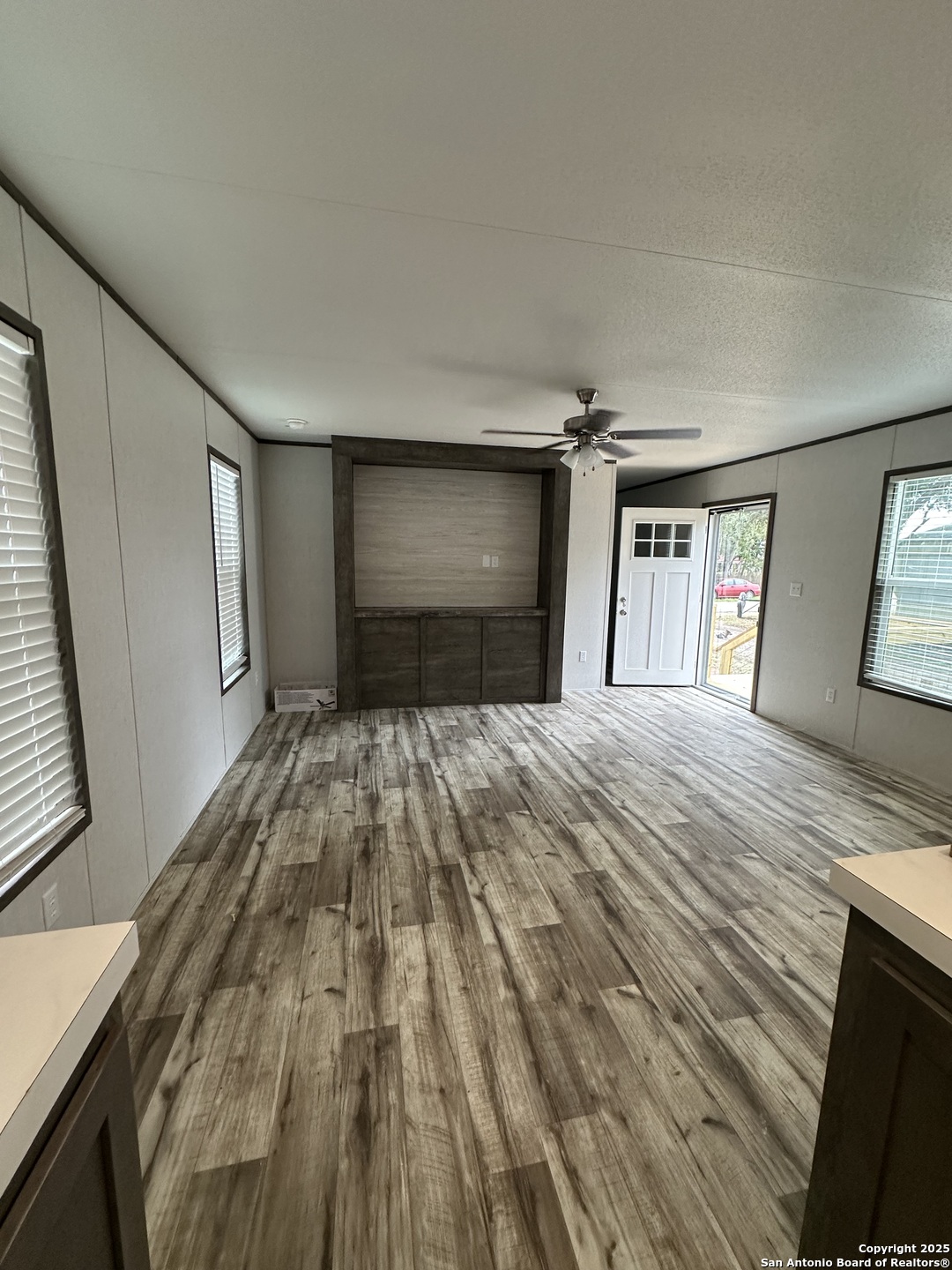 19 Green Meadows Knippa, TX 78870 - Photo 4 of 12 a bedroom with a bed and a mirror