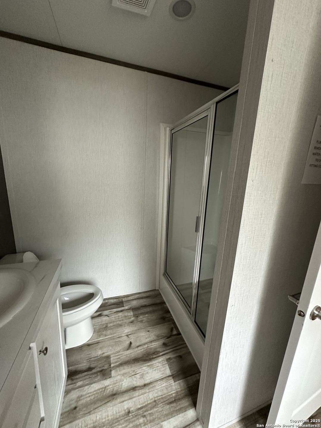 19 Green Meadows Knippa, TX 78870 - Photo 8 of 12 a bathroom with a toilet and a shower