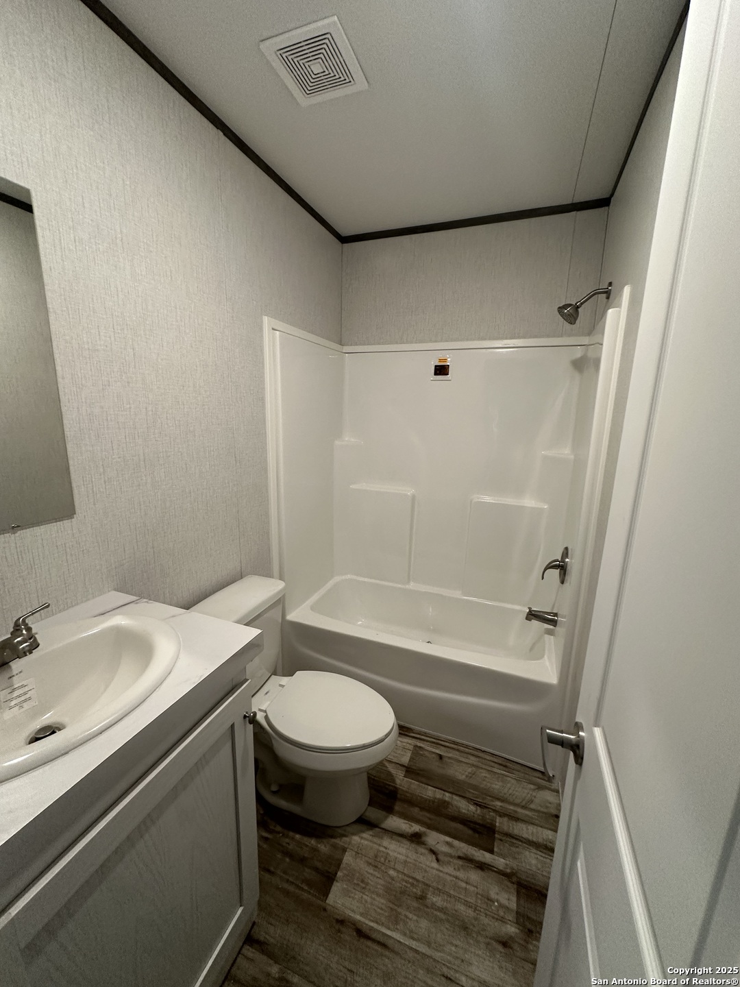 19 Green Meadows Knippa, TX 78870 - Photo 10 of 12 a bathroom with a sink toilet and shower