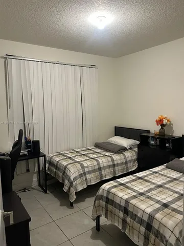a kitchen with stainless steel appliances a refrigerator sink and cabinets