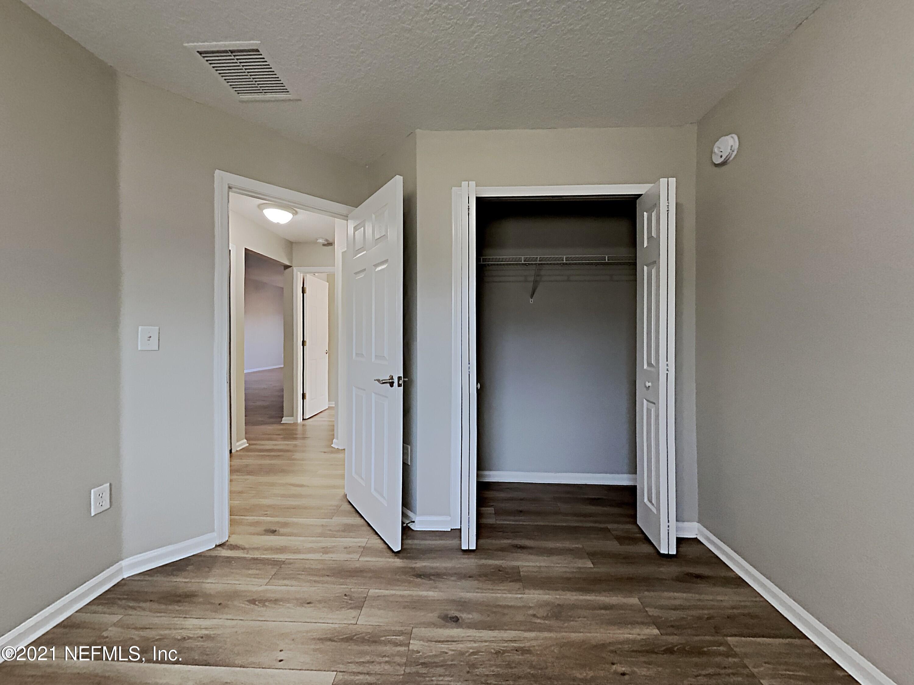 600 Birchbark Trail St. Augustine, FL 32092 - Photo 11 of 16 a view of a hallway with wooden floor