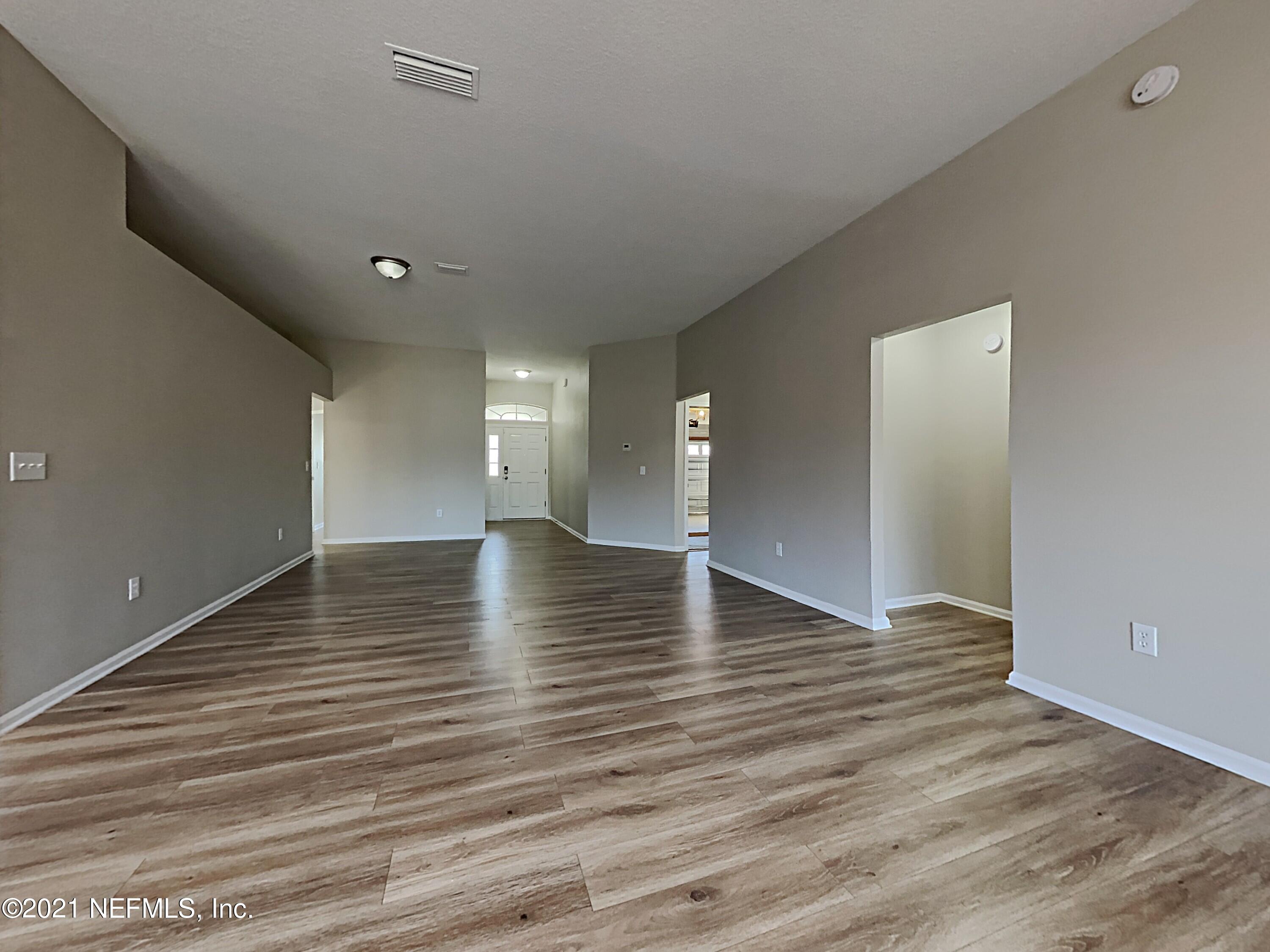 600 Birchbark Trail St. Augustine, FL 32092 - Photo 2 of 16 a view of a livingroom with wooden floor