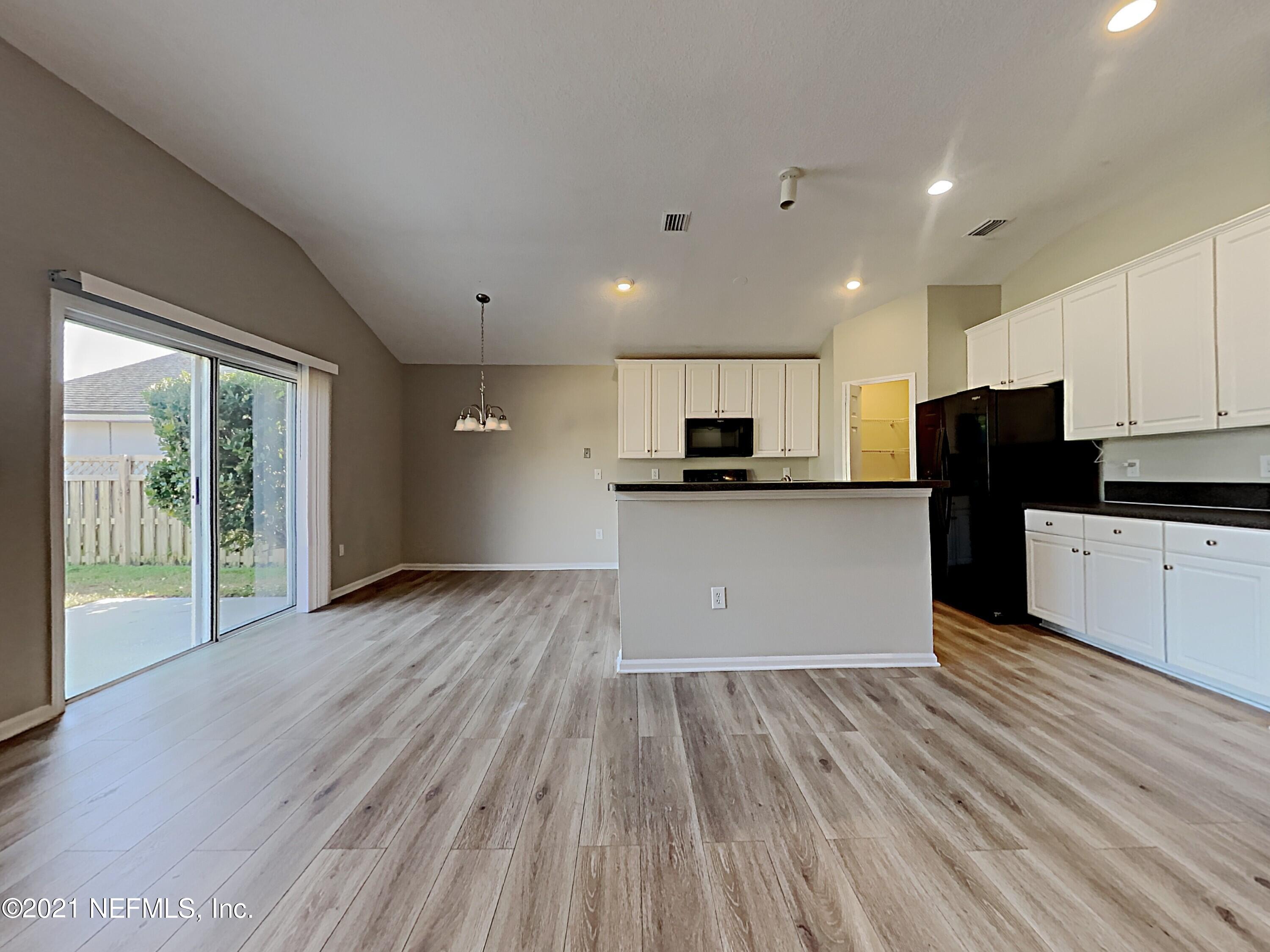 600 Birchbark Trail St. Augustine, FL 32092 - Photo 4 of 16 a view of kitchen with refrigerator microwave and stove top oven