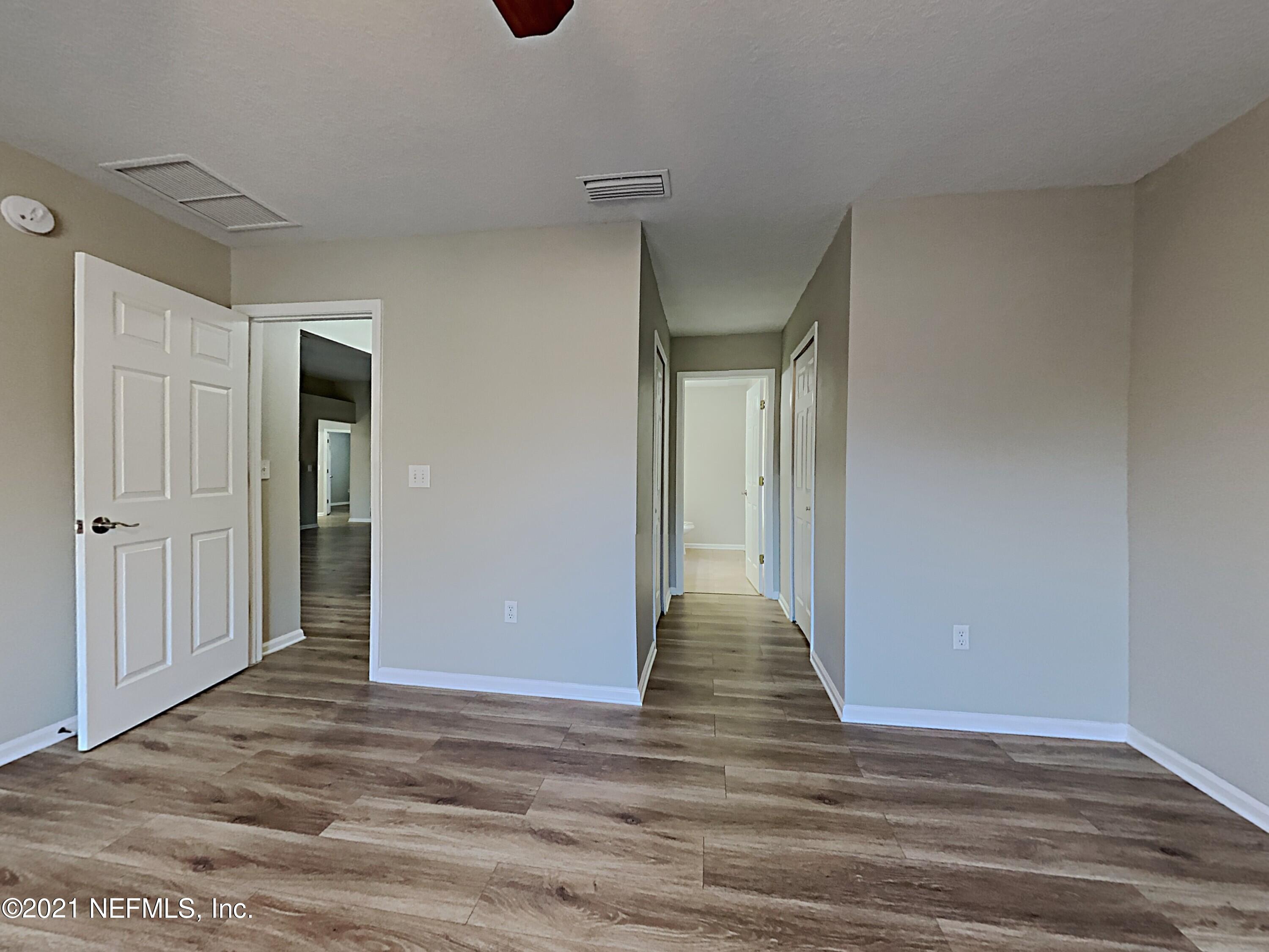 600 Birchbark Trail St. Augustine, FL 32092 - Photo 7 of 16 a view of a hallway with wooden floor