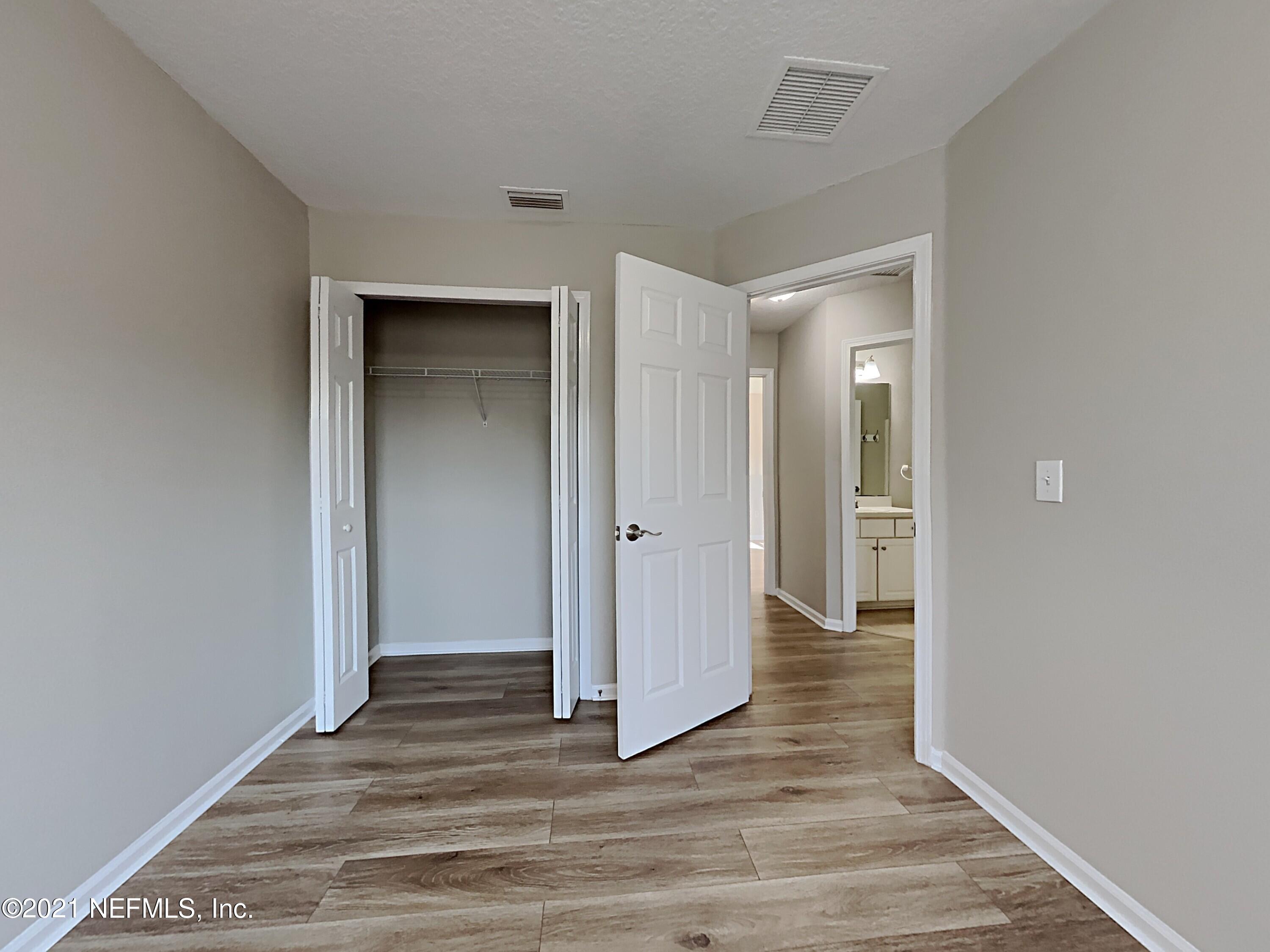 600 Birchbark Trail St. Augustine, FL 32092 - Photo 10 of 16 a view of a hallway with wooden floor