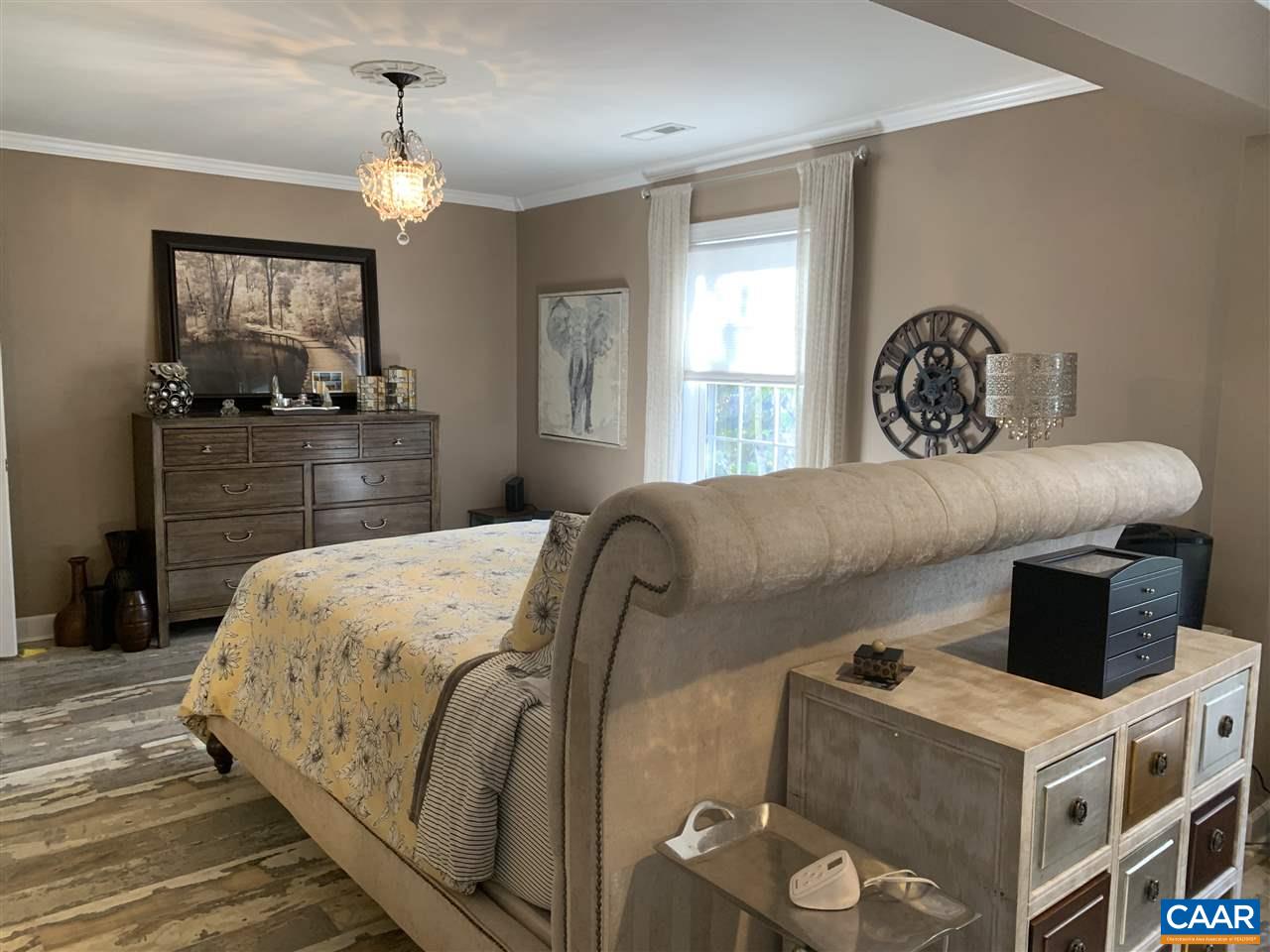 2 Appletree Road Palmyra, VA 22963 - Photo 16 of 49 a bedroom with a bed and a mirror on dresser