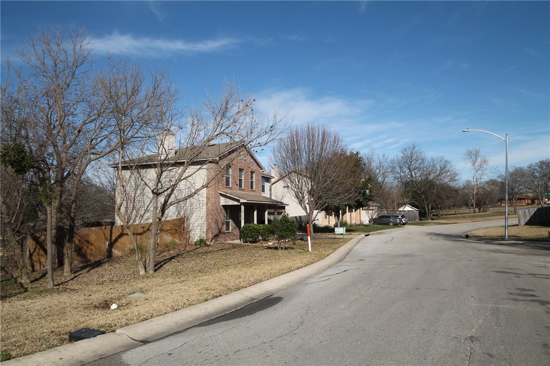 9600 Magna Carta Loop, Unit 177 Austin, TX 78754 - Photo 25 of 25 a row of palm trees and a building in the background