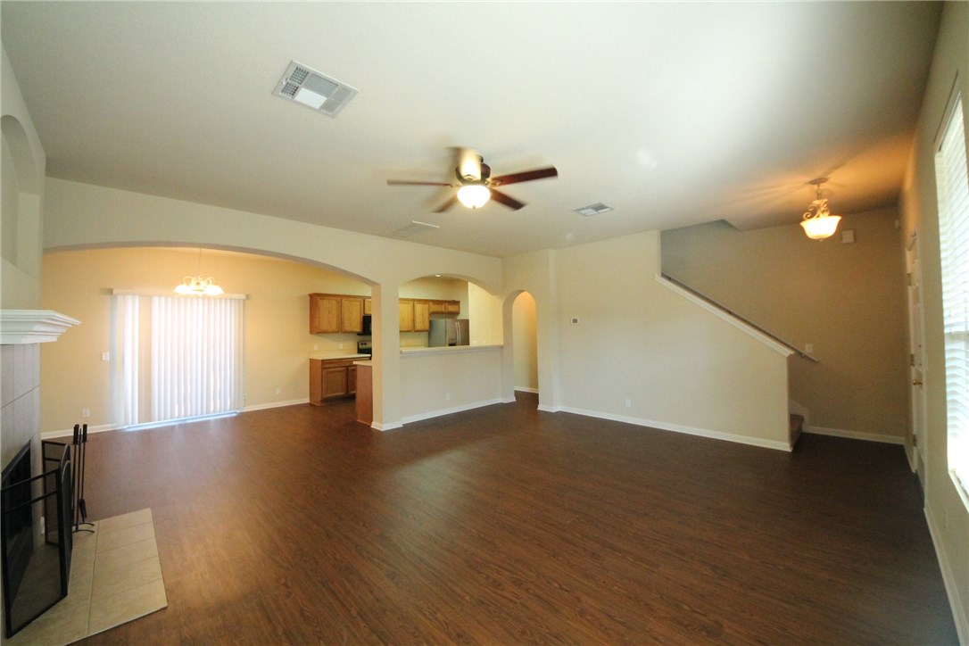 9600 Magna Carta Loop, Unit 177 Austin, TX 78754 - Photo 4 of 25 wooden floor in an empty room with a window