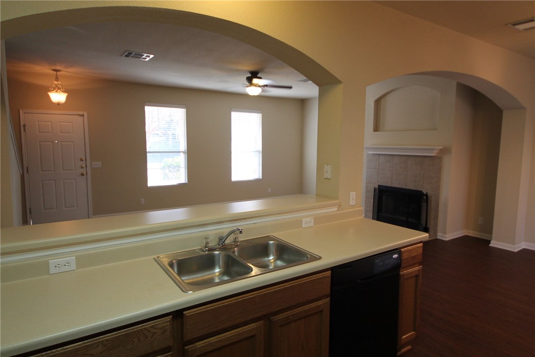9600 Magna Carta Loop, Unit 177 Austin, TX 78754 - Photo 8 of 25 a kitchen with a sink and a stove