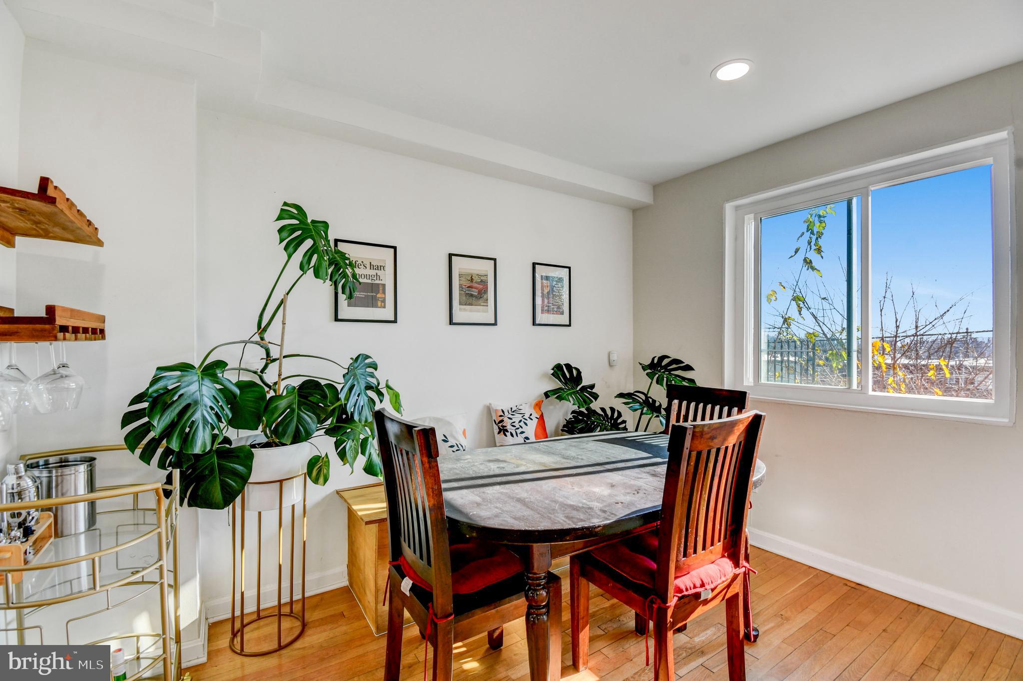 1371 Adams Street Northeast Washington, DC 20018 - Photo 12 of 34 a view of a dining room with furniture and a potted plant