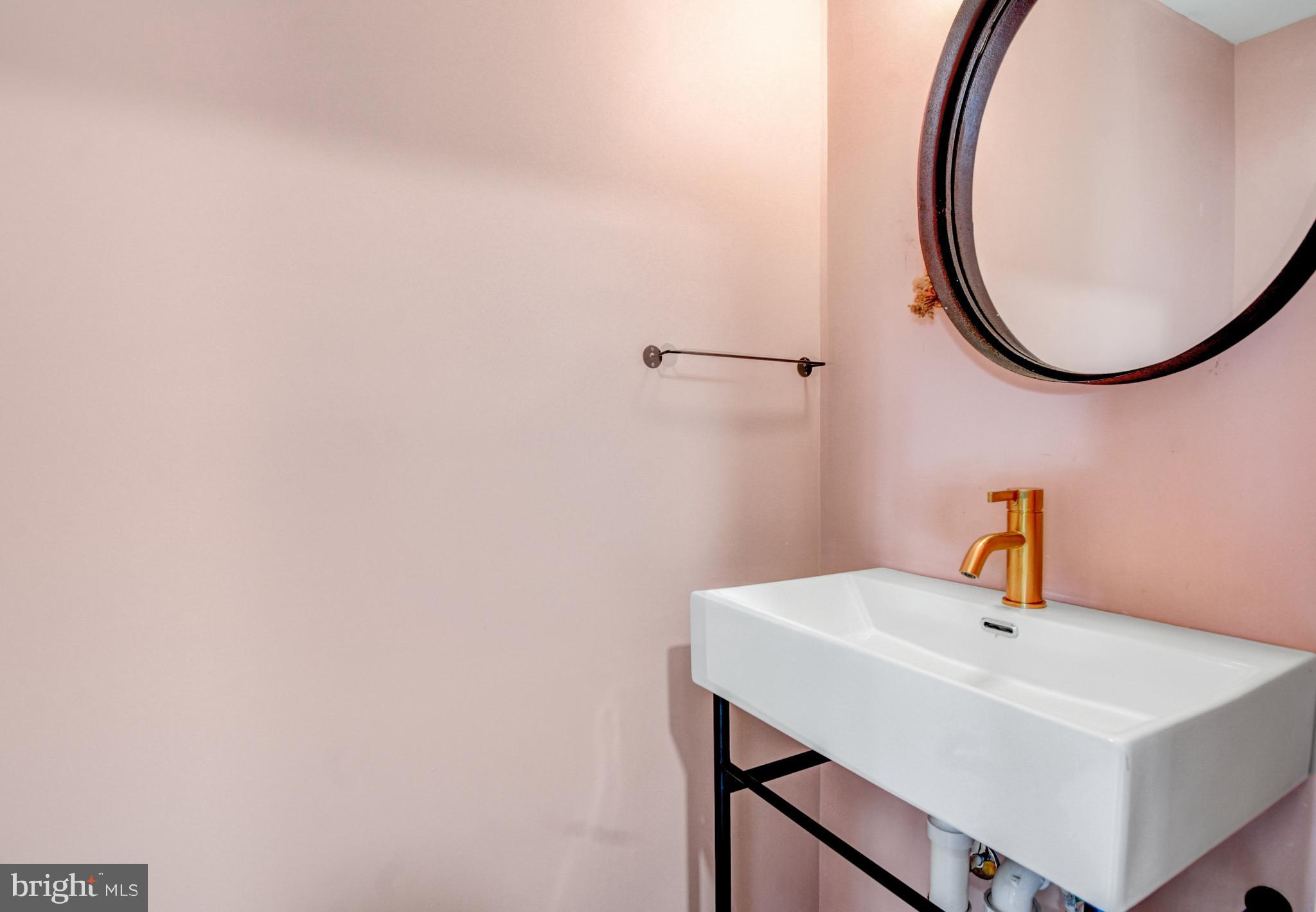 1371 Adams Street Northeast Washington, DC 20018 - Photo 14 of 34 a bathroom with a sink and a mirror
