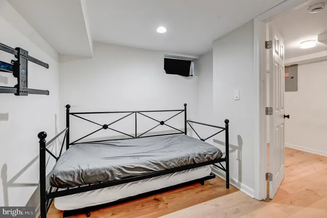 a bedroom with a bed and cabinets