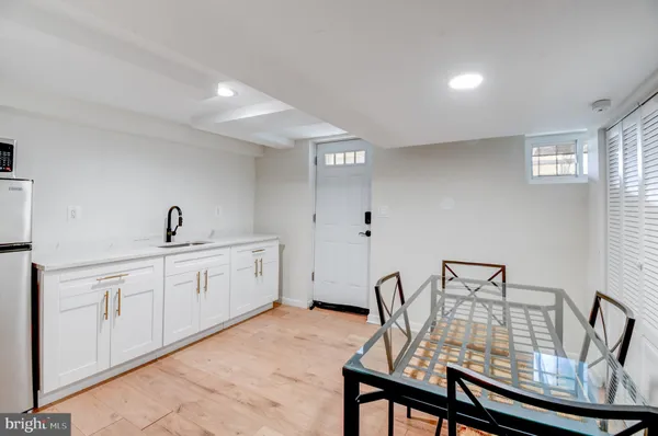 a view of a livingroom with furniture window and wooden floor